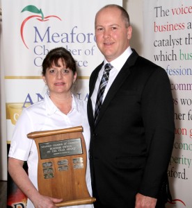 Nancy Ellis of Simply Unique Flowers & Gifts accepting the award for Business Owner of the Year- Sponsored by the BIA, presented by Chris Davies
